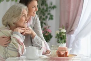 Senior woman with daughter with tea